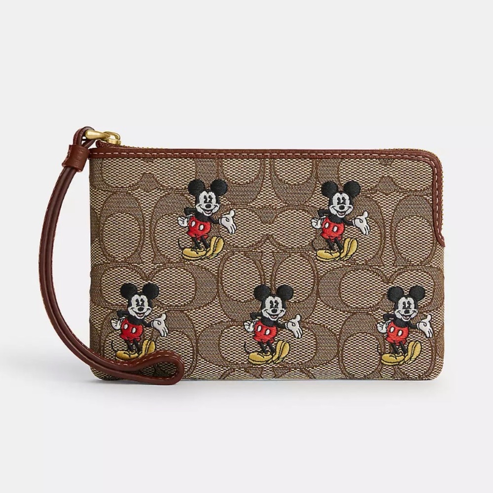 DISNEY X COACH CORNER ZIP WRISTLET IN SIGNATURE JACQUARD WITH MICKEY MOUSE PRINT